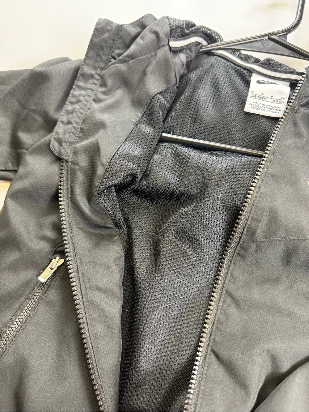 Nike Kids Black Hooded Rain Jacket with White Logo